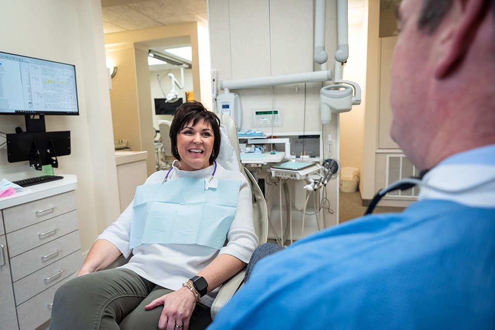 Patient in chair at our cosmetic dentist in Midland, MI