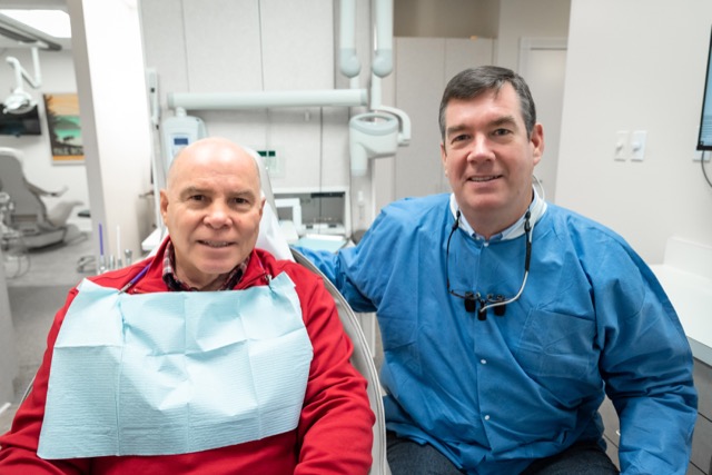 Dr. Knight, a cosmetic dentist in Midland, MI, with a patient